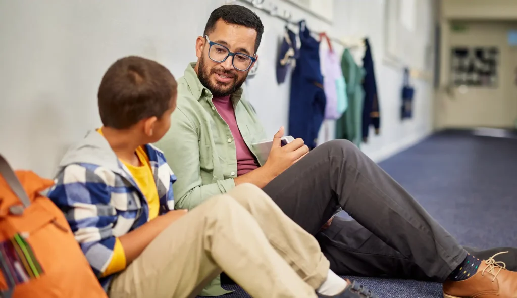 teacher talking to student
